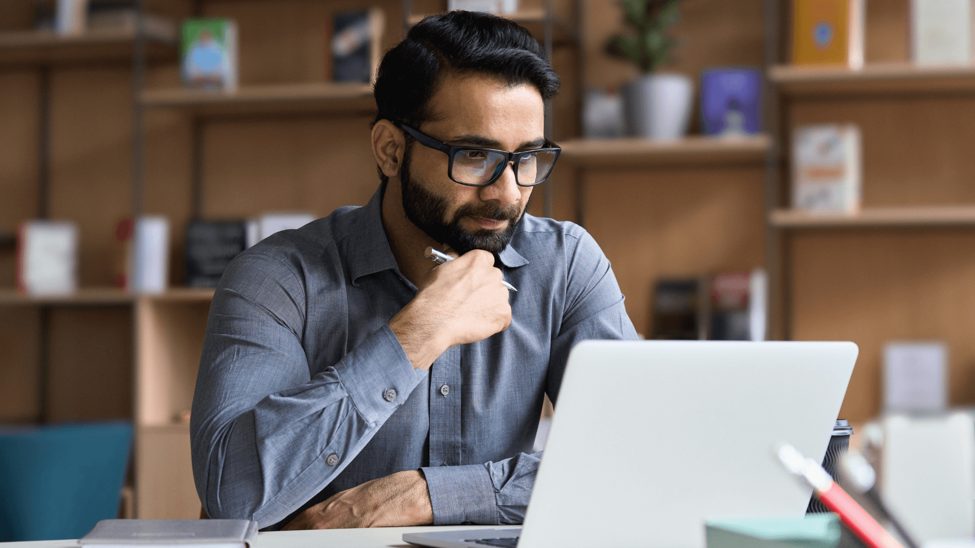 A professional man working at his laptop learning about civil litigation