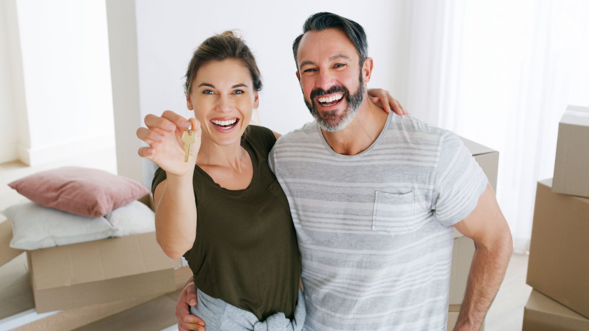 A happy couple who have taken the next step in their lives through co-ownership of property