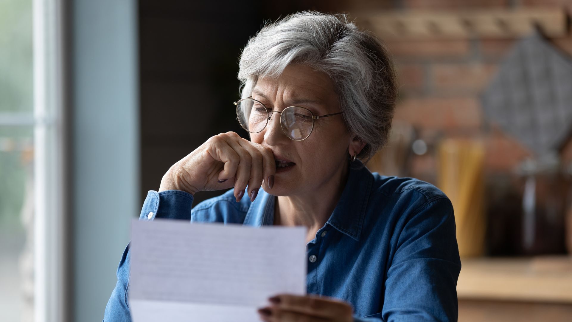A woman reading over an eviction order