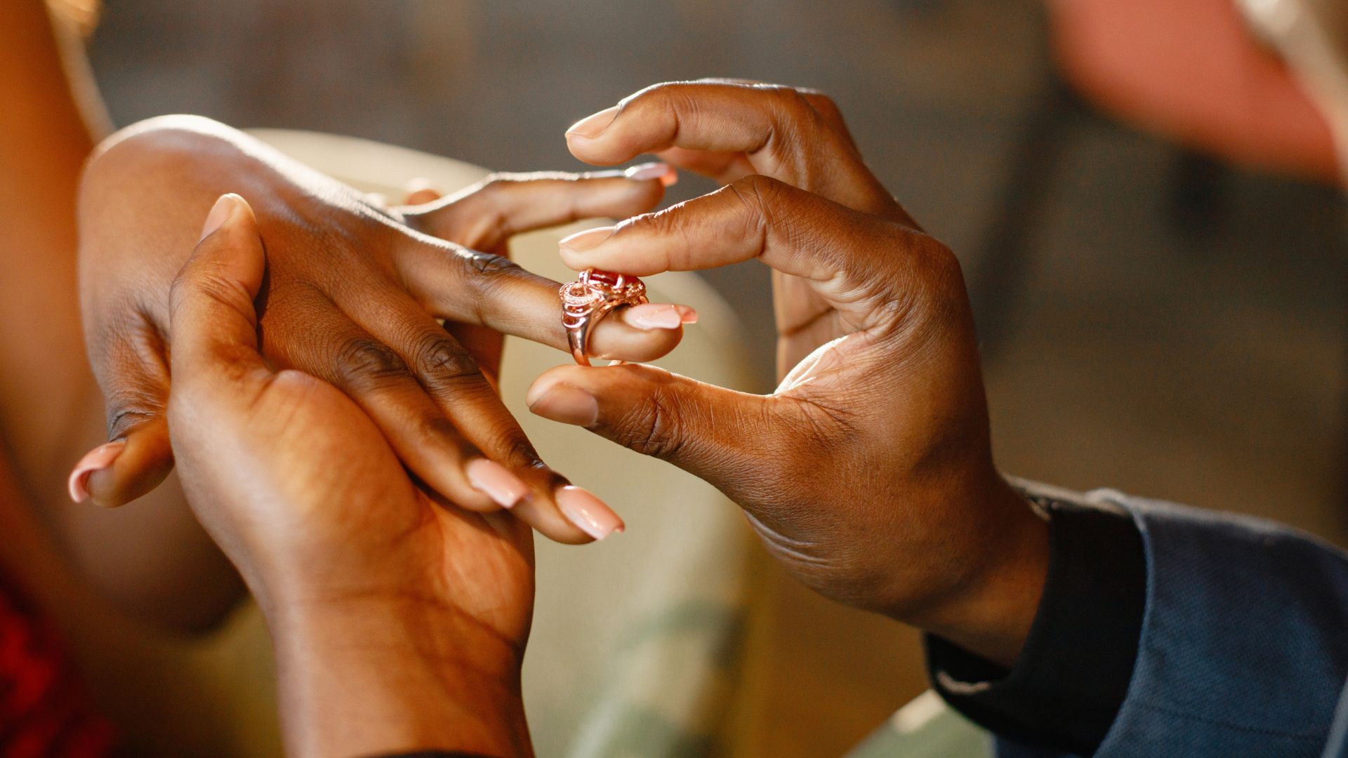 A ring being put on the brides finger, this will usually take place after lobola has been negotiated and paid