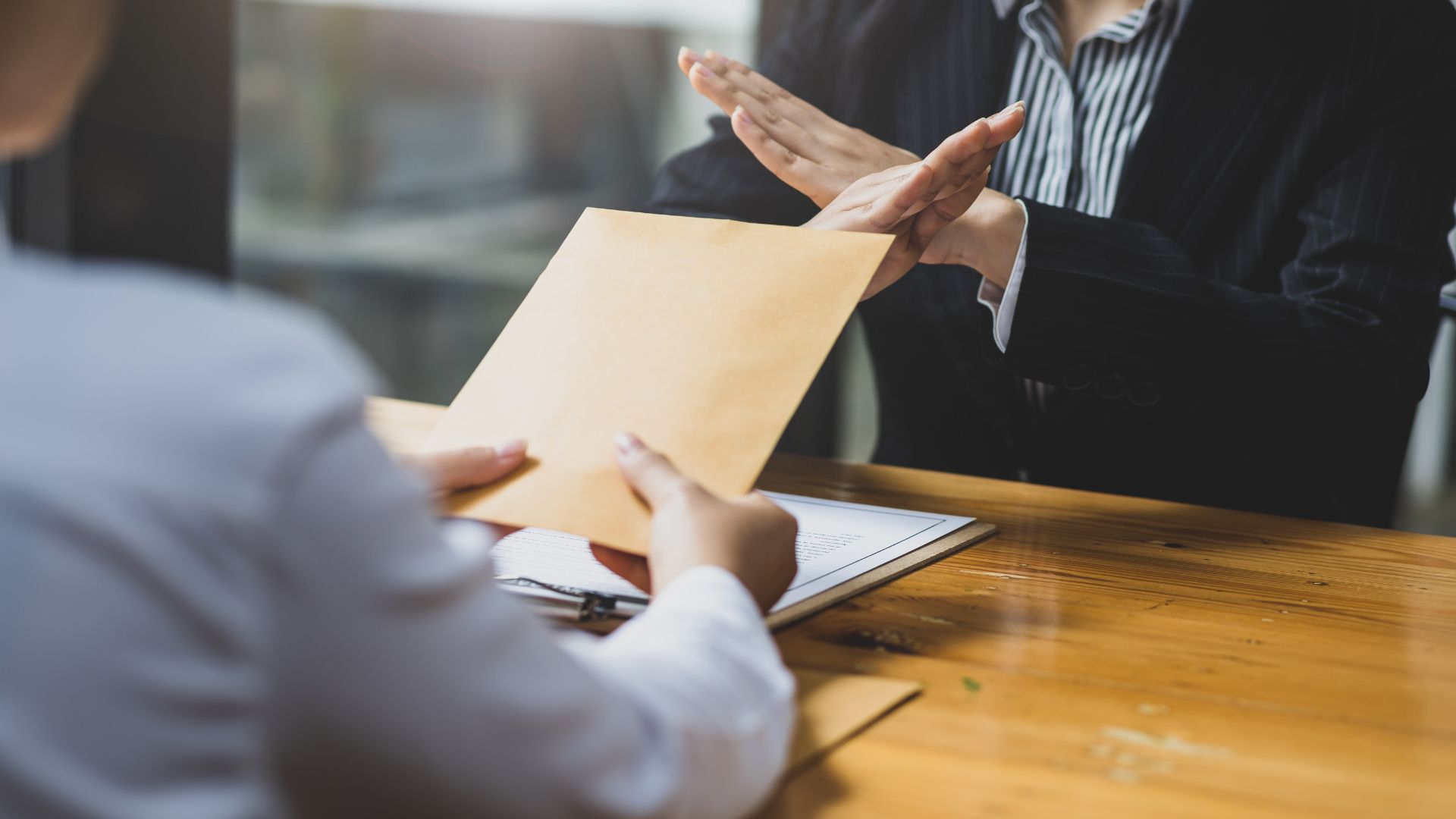 A lawyer rejecting a bribe and upholding the ethics of their profession
