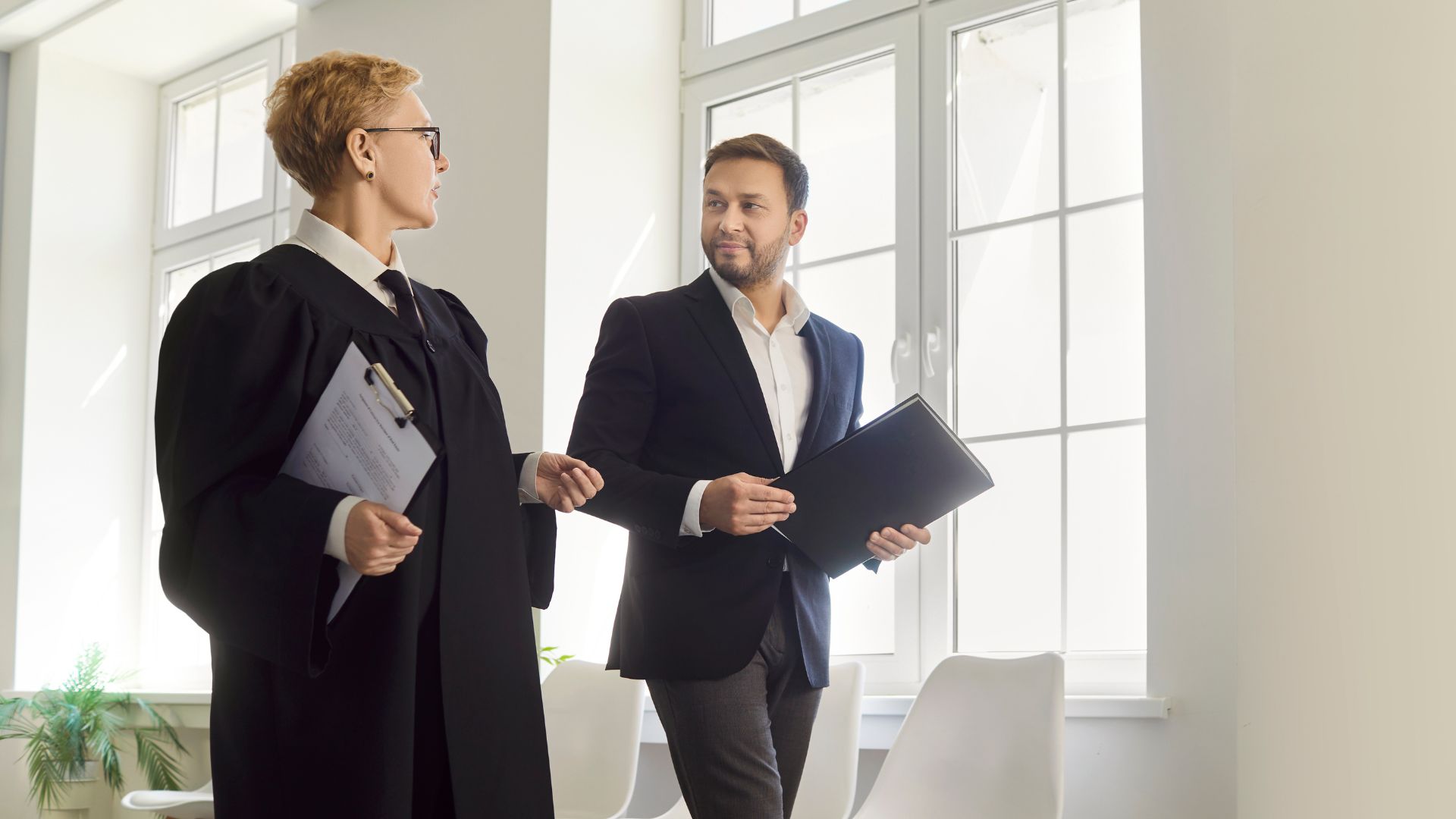 A magistrate walking and talking with a colleague
