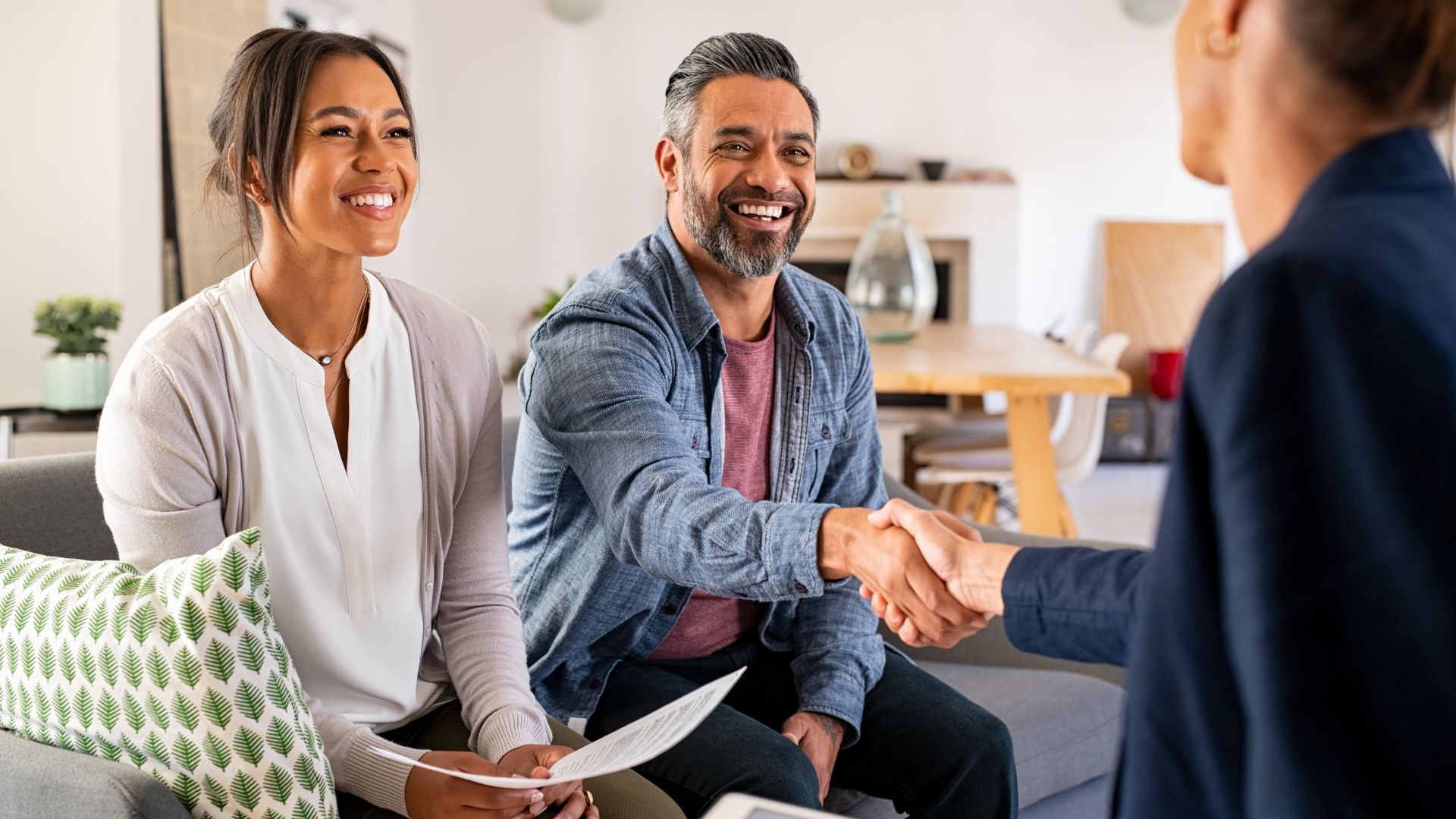 A couple securing a home loan to purchase a house