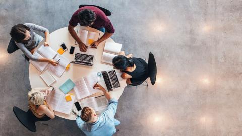 Students studying around a table.